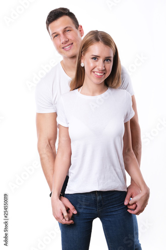 Romantic couple embracing each other on white
