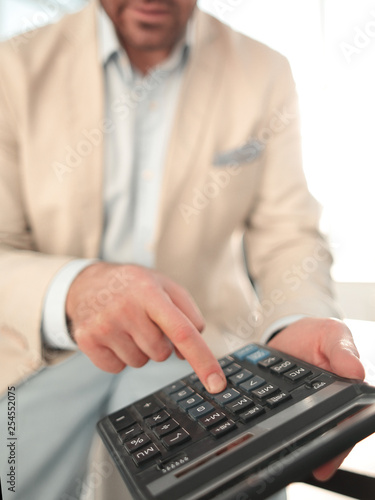 close up. businessman with calculator.