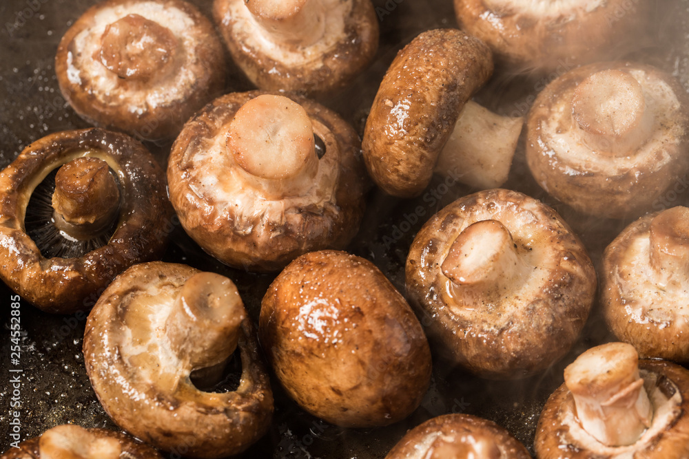 mushrooms beeing fried in a pan mushrooms beeing fried in a pan