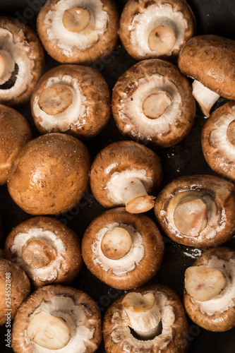 mushrooms beeing fried in a pan
