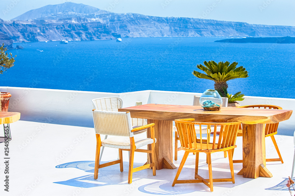 Romantic Summer Open Air Terrace in Oia Village in Santorini In Greece.