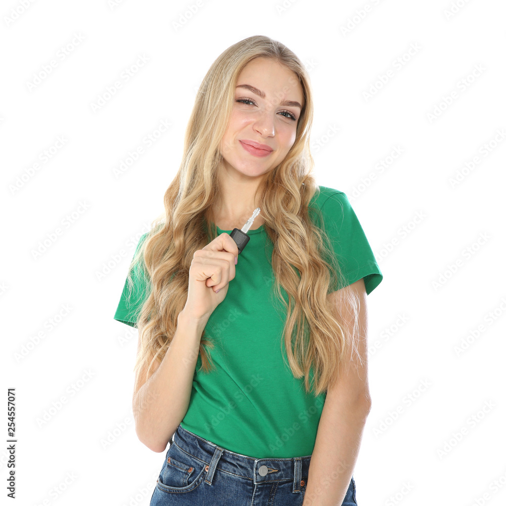Happy young woman with car key on white background. Getting driving license Happy young woman with car key on white background. Getting driving license