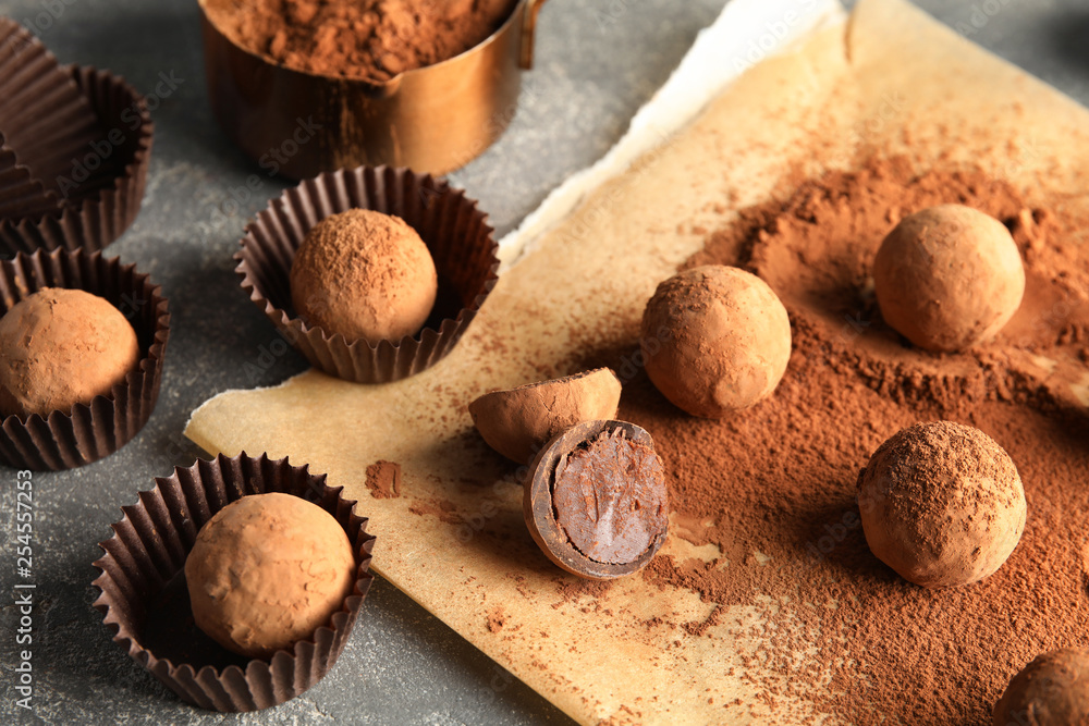 Composition with chocolate truffles on grey background Composition with chocolate truffles on grey background