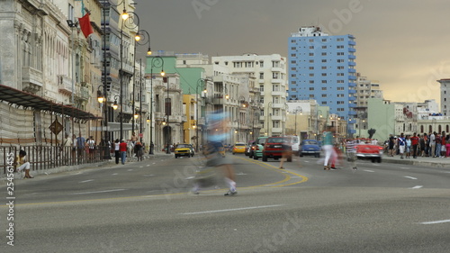 Photography blurry pedestrian crossing a busy street in havana, cuba