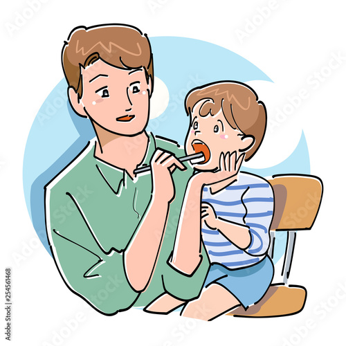 子供の歯を磨くパパ