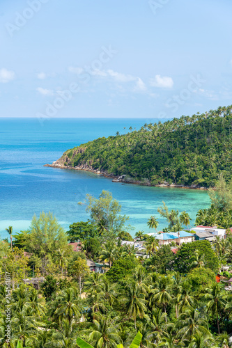 Beautiful tropical sand beach and blue sea water with coconut palm tree in paradise island, Thailand. Travel concept. Top view