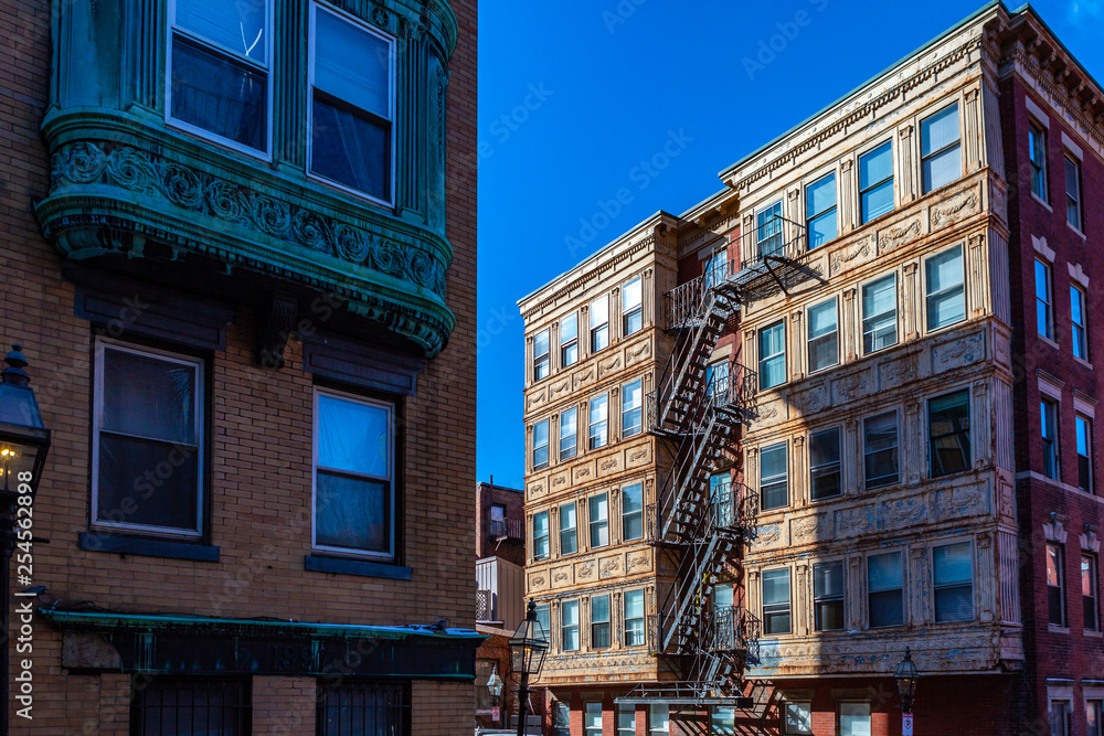 Boston, USA- March 01, 2019: picturesque Boston Streets with brick tiles and buildings. Boston is Capital city of state Massachusetts, United states of America Boston, USA- March 01, 2019: picturesque Boston Streets with brick tiles and buildings. Boston is Capital city of state Massachusetts, United states of America