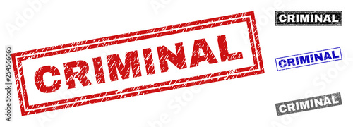 Grunge CRIMINAL rectangle stamp seals isolated on a white background. Rectangular seals with grunge texture in red, blue, black and grey colors.