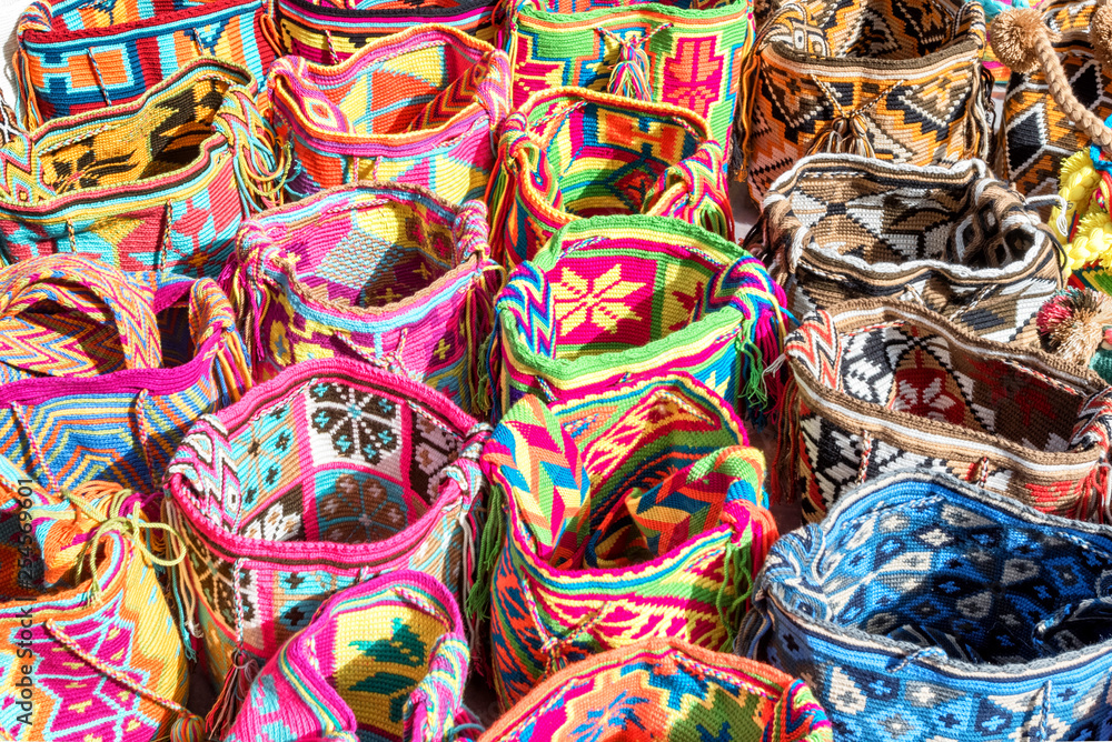 Mochilas guayu, colorful knit bags for sale in Bogota, Colombia at a street market