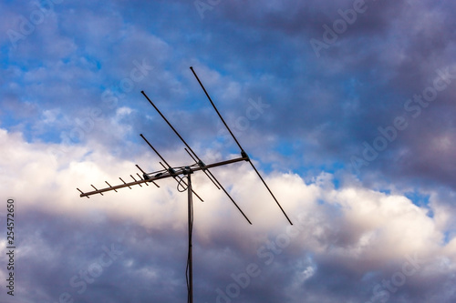 TV antenna point north durning sunset. © timallenphoto