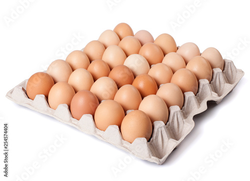Eggs in cardboard box isolated on white background. Full depth of field.