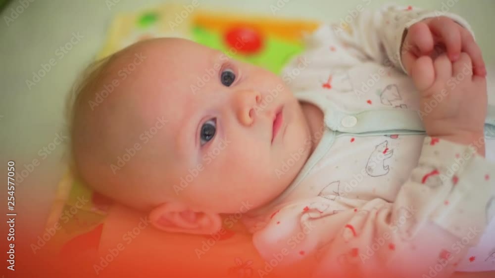 Newborn Lying in a Crib and Looking Around Newborn Lying in a Crib and Looking Around