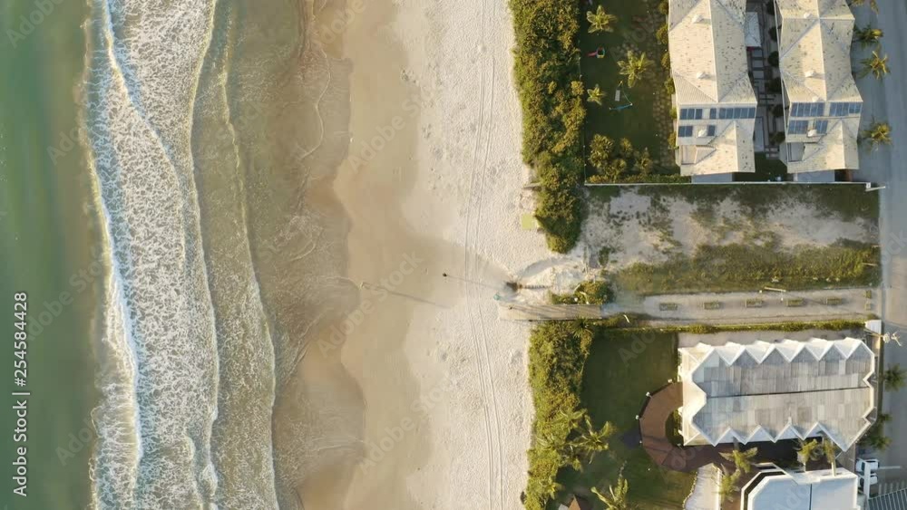 Beautiful aerial cinematic top view of a brazilian beach with white sand and emerald clear water at sunrise. Mariscal, Santa Catarina, Brazil Beautiful aerial cinematic top view of a brazilian beach with white sand and emerald clear water at sunrise. Mariscal, Santa Catarina, Brazil