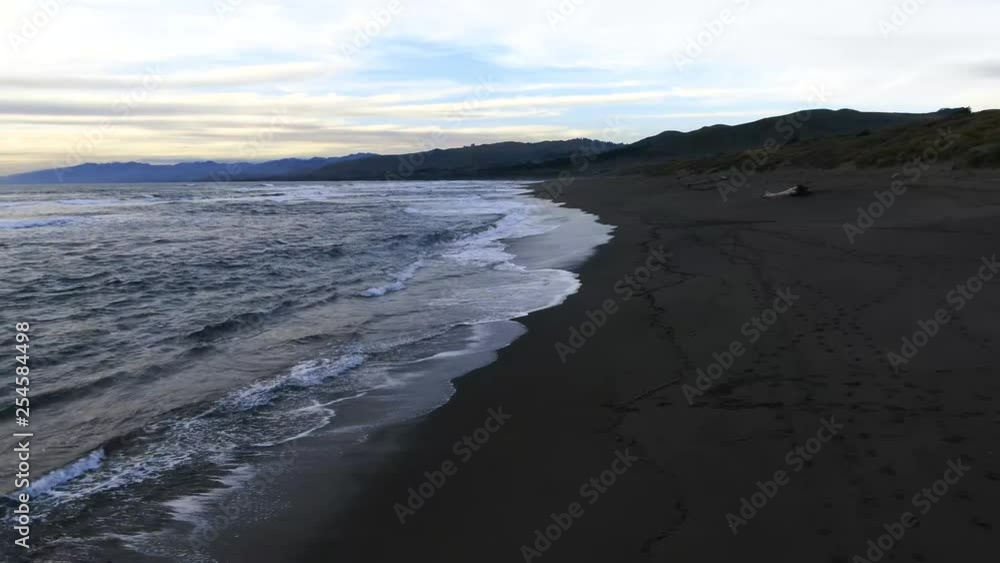 Sunset leaking through cloud cover at beach. Vibrant and beautiful Sunset leaking through cloud cover at beach. Vibrant and beautiful