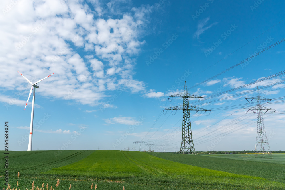 Power lines and a wind turbine seen in rural Germany