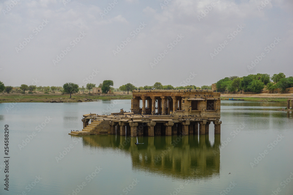 An old building in the middle of a lake in Jaisalmer, India