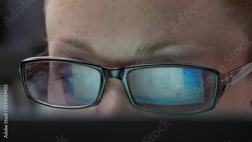 Wallpaper Mural Reflection of a laptop screen in Woman Glasses at night. Businesswoman using computer browsing internet. Torontodigital.ca