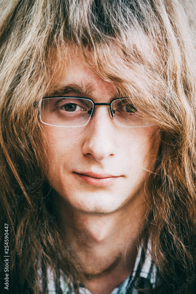 Portrait Of Rock Star Young Man Guy With Glasses And Long Hair Portrait Of Rock Star Young Man Guy With Glasses And Long Hair