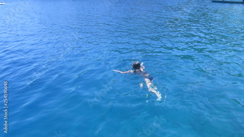 girl swims in the sea