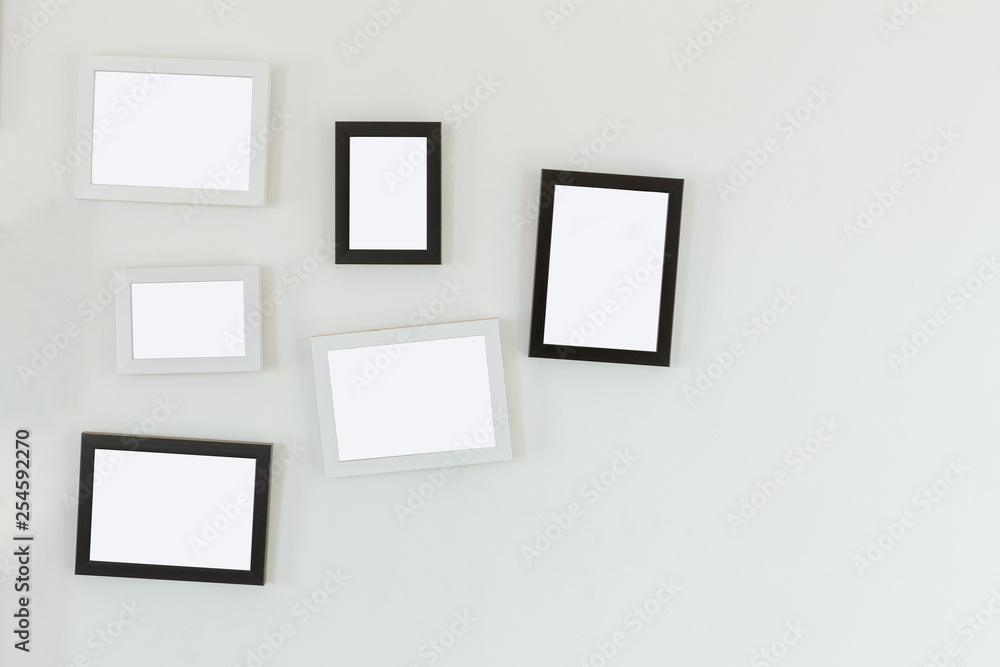 frames hanging on white wall frames hanging on white wall