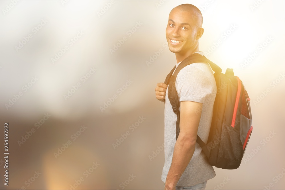 Male student with backpack on background Male student with backpack on background