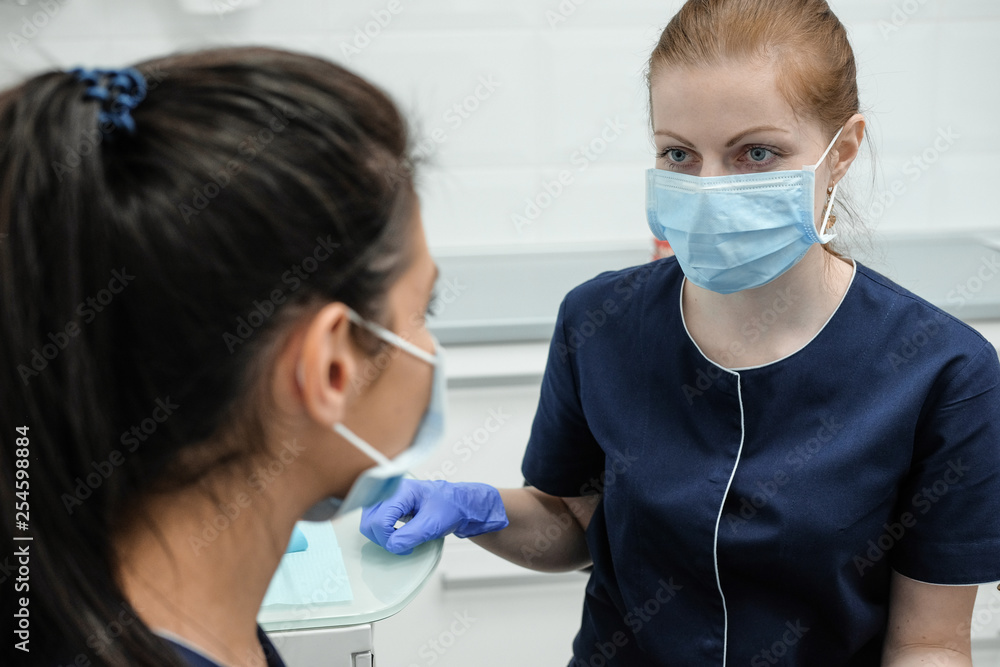 Womans dentist working in the dental office. Womans dentist working in the dental office.