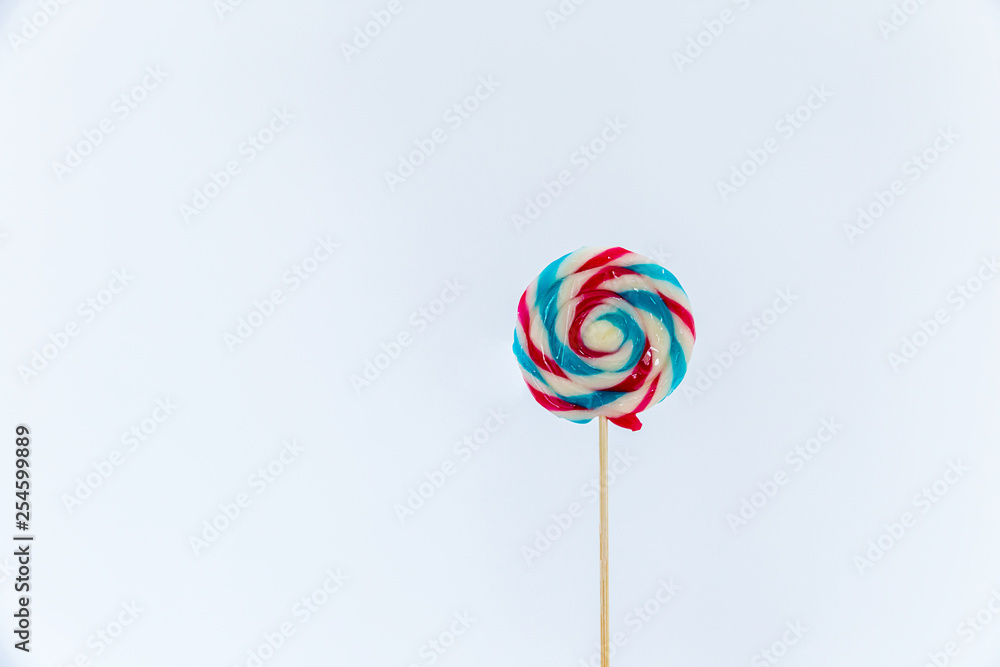 colorful handmade swirl lollipop isolated on white background. multicolored lollipop, Tasty colorful fruit flavored candy. striped lollipop.sweet candy making from sugar on white background. colorful handmade swirl lollipop isolated on white background. multicolored lollipop, Tasty colorful fruit flavored candy. striped lollipop.sweet candy making from sugar on white background.