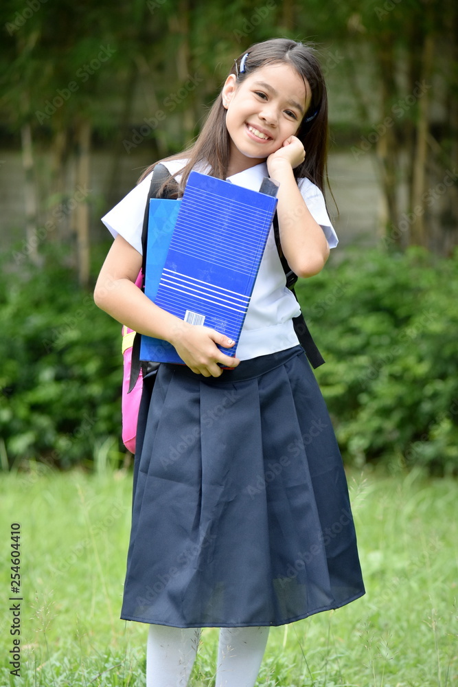 Diverse Child Girl Student And Happiness Wearing Uniform With Notebooks Diverse Child Girl Student And Happiness Wearing Uniform With Notebooks