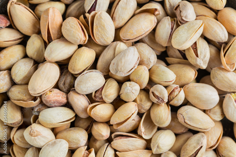 Pistachio texture. Nuts. Green fresh pistachios as texture. Close-up. Pistachio texture. Nuts. Green fresh pistachios as texture. Close-up.