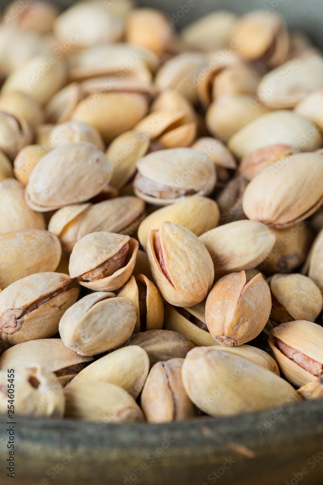 Pistachio texture. Nuts. Green fresh pistachios as texture. Close-up.