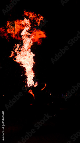 Man doing fire breathe as a street or circus performance
