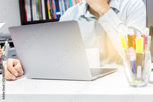 Businessman workspace and laptop with coffee cup at office room