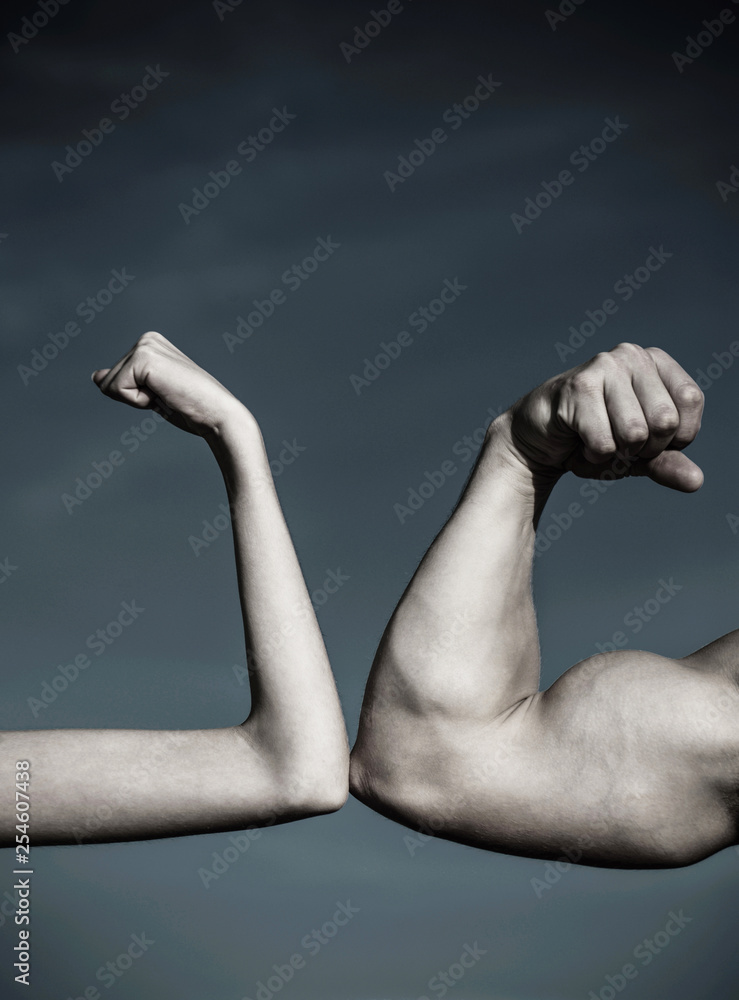 Rivalry, vs, challenge, strength comparison. Muscular arm vs weak hand