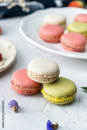 Macaron or French macaroon cookies dessert. Set on cafe table.