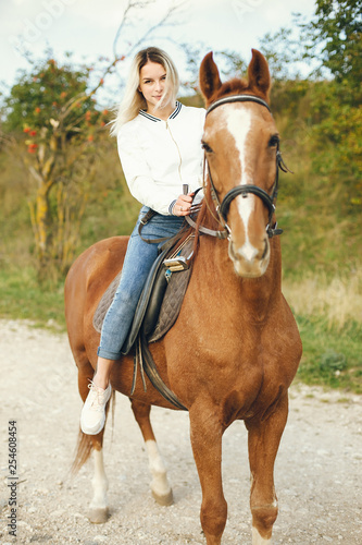 woman with horses © hetmanstock2