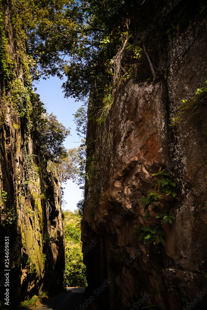 Road landscape with the splitted rock, Kara region, Togo Road landscape with the splitted rock, Kara region, Togo