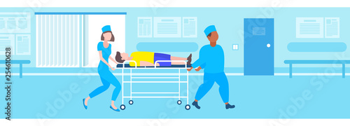 male female doctors moving patient in hospital bed stretcher medical mix race staff in uniform transporting man to operating room hospital interior flat full length horizontal