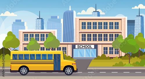 yellow bus on road in front of school building exterior back to school pupils transport concept cityscape background flat horizontal