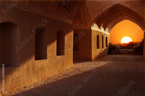 Iran. Neighborhood Yazd. Towers of silence. Sunset on the background of traditional architecture. photo