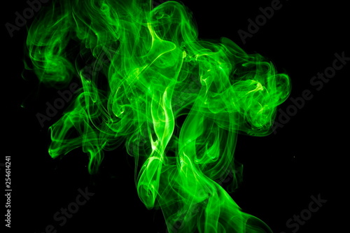 Green smoke on black background