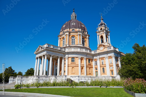 Superga basilica on Turin hills with flowerbed and clear blue sky in a sunny summer day in Italy