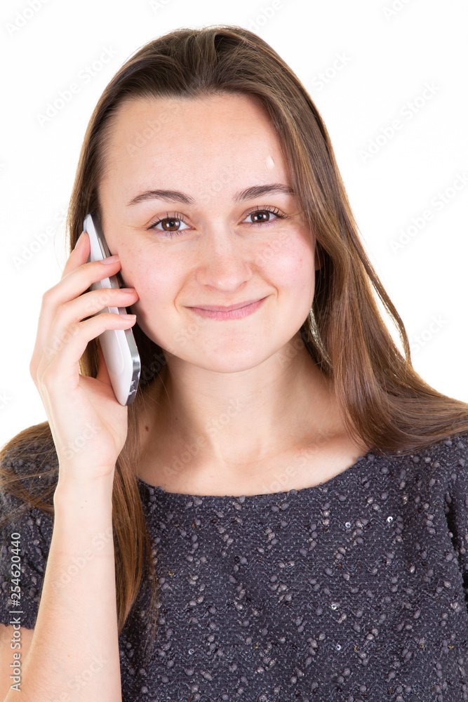 Portrait of smiling young pretty woman talk on cell phone isolated on white background Portrait of smiling young pretty woman talk on cell phone isolated on white background