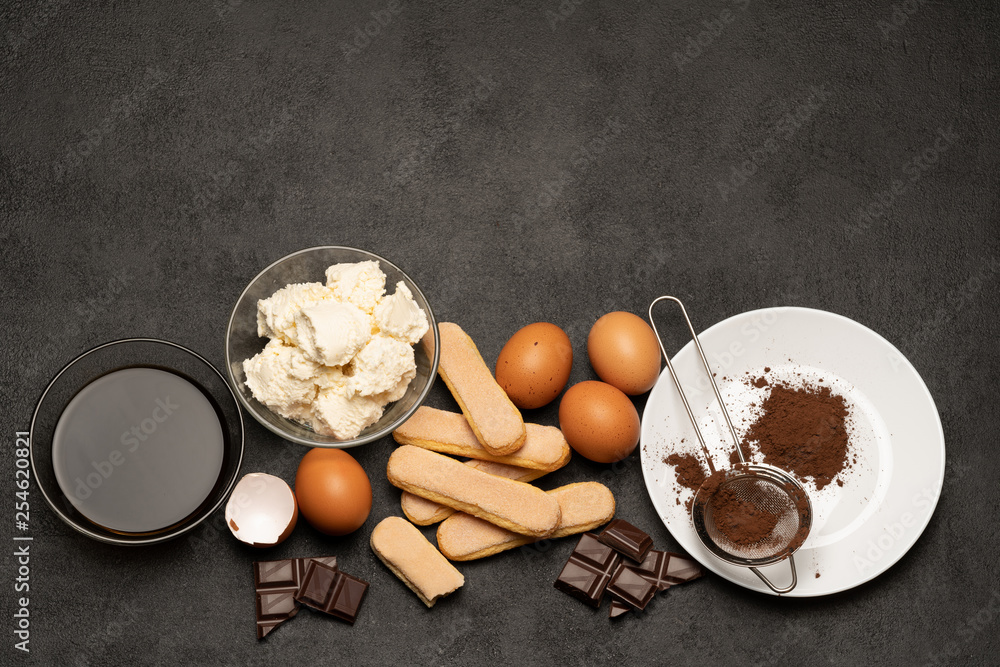 Ingredients for cooking tiramisu - Savoiardi biscuit cookies, mascarpone, cream, sugar, cocoa, coffee and egg Ingredients for cooking tiramisu - Savoiardi biscuit cookies, mascarpone, cream, sugar, cocoa, coffee and egg