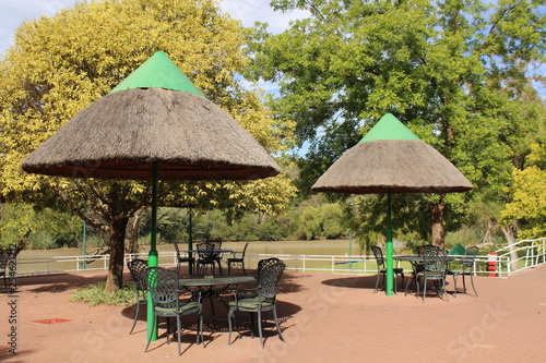 Tables with chairs under sun umbrellas in a holiday resort