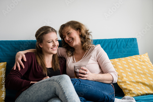 A happy family. Mother and teen daughter at home.