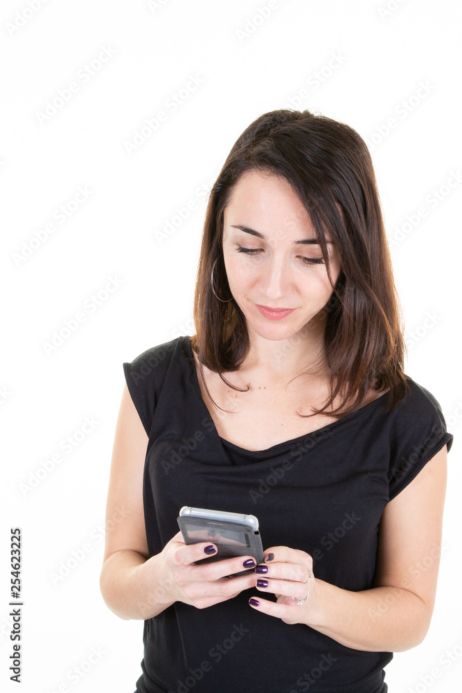 Happy young woman having a chat holding her cell phone Happy young woman having a chat holding her cell phone