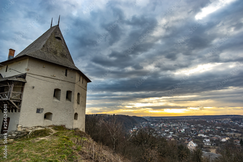 Fototapeta premium Tower of a medieval castle at sunset