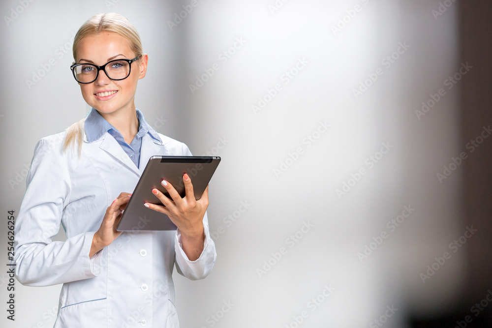 female doctor using her digital tablet female doctor using her digital tablet