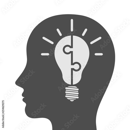 Human head silhouette with light bulb puzzle. Idea and creativity concept