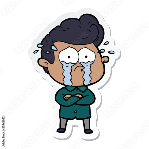 sticker of a cartoon crying man with crossed arms